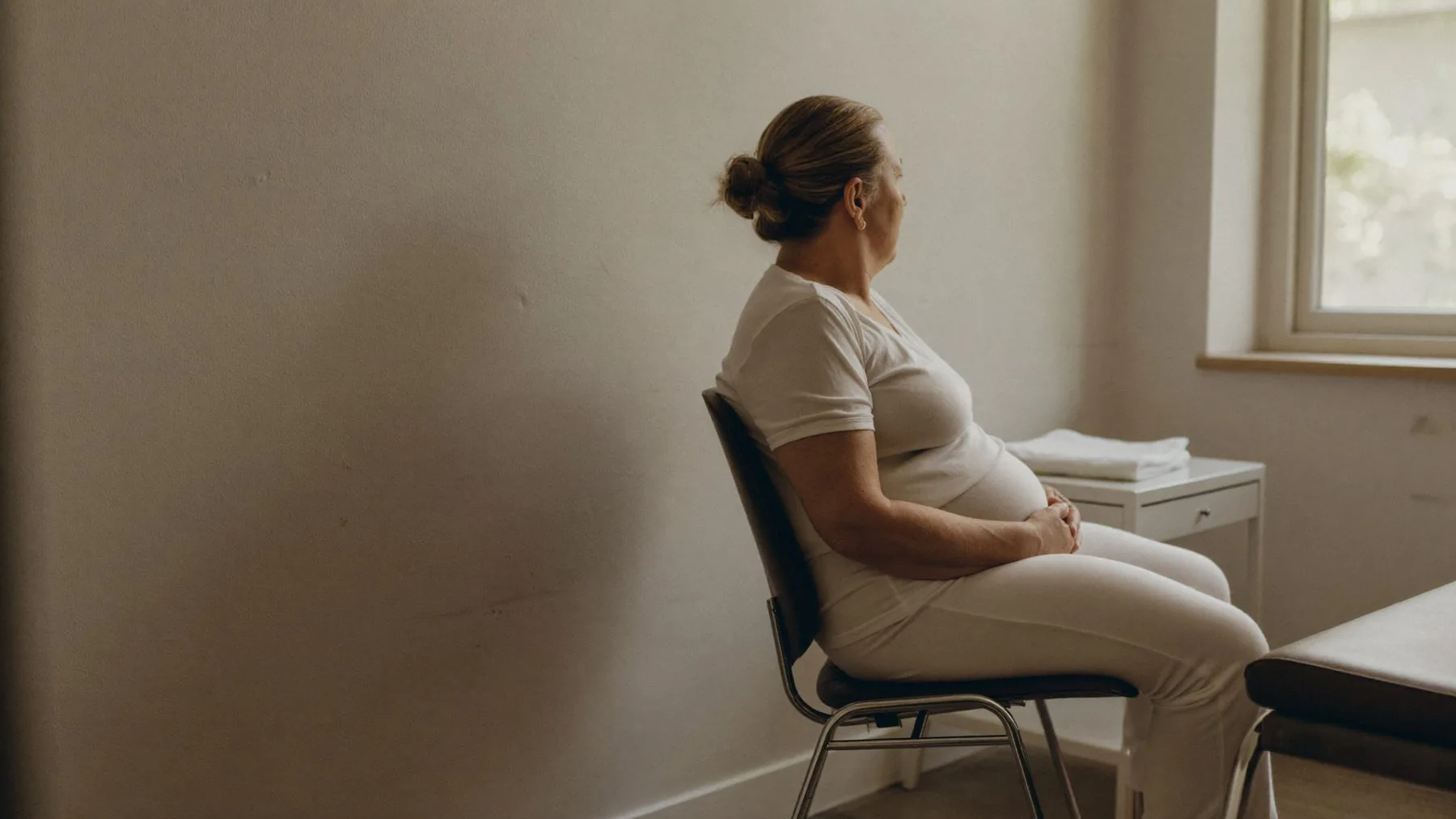 A client seated for a session, fully clothed