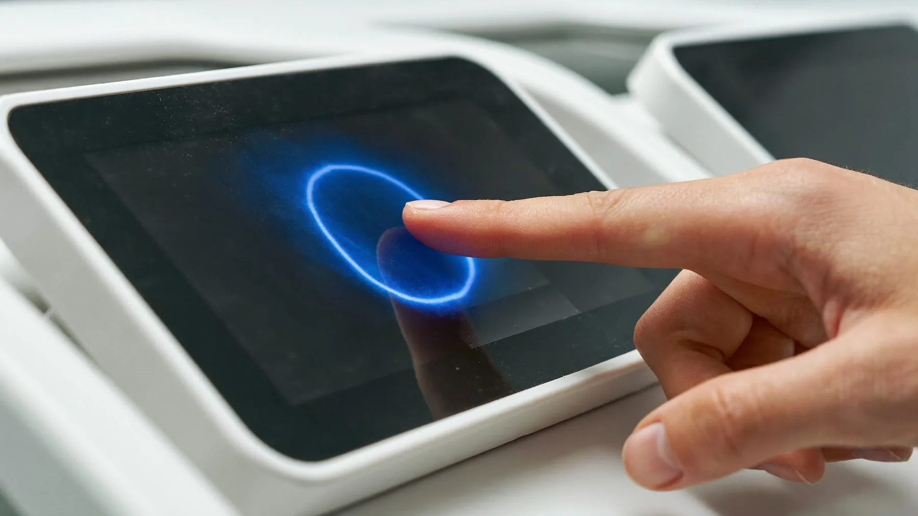 An operator adjusting a console touchscreen